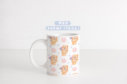 Ly sứ gấu nhỏ ôm hoa